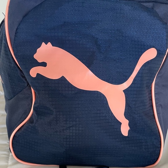 A navy blue and baby pink Puma duffel bag. - Picture 5 of 7